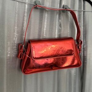 red metallic purse